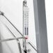 A Hatco stainless steel countertop merchandiser with a thermometer attached to the metal surface.