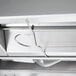 A Hatco stainless steel countertop food merchandiser with wire shelves.