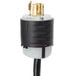 A close-up of a black and white plug with a gold wire.