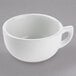 A Tuxton bright white china cappuccino cup with a handle.