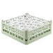 A light green Vollrath plastic glass rack with 20 small compartments.