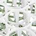 A close-up of a white and green plastic Vollrath Signature Lemon Drop glass rack.