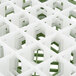 A close up of a white and green Vollrath glass rack grid.
