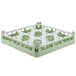 A white and green plastic Vollrath glass rack with 9 compartments.