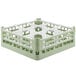 A light green plastic Vollrath glass rack with nine compartments.