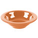 A close up of a pumpkin melamine bowl with an orange surface.