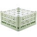 A light green plastic Vollrath glass rack with 16 compartments.