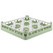 A white and green plastic Vollrath glass rack with 9 compartments.