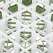 A Vollrath light green glass rack with 25 compartments.