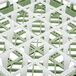 A white and green plastic Vollrath glass rack with 25 compartments.