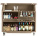 A brown Cambro portable bar cart with bottles of alcohol.