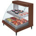 A Hatco countertop display case with trays of cooked chicken and meatballs inside.