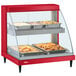 A red Hatco countertop food warmer display with two shelves of food.
