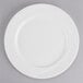 A Tuxton AlumaTux Pearl White china plate with a wavy design.