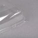A clear plastic Sabert catering tray with a high dome lid.