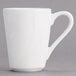 A white Tuxton China mug with a handle.