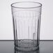 A clear Carlisle plastic tumbler.