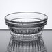 A Libbey clear glass ramekin with a patterned rim.