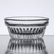 A clear Libbey Winchester glass ramekin with a pattern on it.