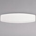 A white rectangular Tuxton AlumaTux china plate on a grey background.