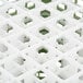 A close up of a white grid with light green accents.