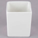 A white square Tuxton AlumaTux ramekin with a lid.