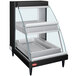 A black Hatco countertop display case with a glass door and double shelves.