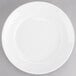 A Tuxton AlumaTux Pearl White bowl with a circular edge.