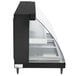 A black rectangular Hatco countertop display case with clear glass shelves and a glass door.