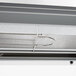 A metal shelf in a Hatco countertop warmer with a metal hook.