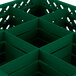 A green plastic box with holes for 9 glasses.