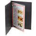 A black Menu Solutions Chicago screw-post menu cover with a menu inside.