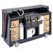 A Carmel Cambro portable bar with bottles on it.