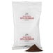 A white Ellis 100% Colombian Decaf Coffee packet with red text on it.