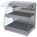 A gray Hatco countertop merchandising warmer with glass shelves and a curved glass top.
