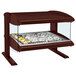 A Hatco heated zone merchandiser with food on a tray in a glass display case.