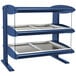 A blue and silver Hatco heated zone merchandiser shelf with three trays on it.