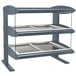 A grey metal Hatco countertop warmer with two metal shelves and glass panels.