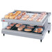 A Hatco Granite Glo-Ray heated glass shelf with food trays on it.