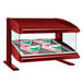 A red Hatco countertop heated zone display case with pizza boxes inside.