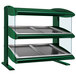 A Hatco Hunter Green Slanted Double Shelf Heated Zone Merchandiser on a counter with glass shelves.