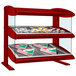 A red Hatco countertop heated food display case with food on slanted shelves.