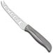 A Franmara stainless steel cheese knife with a serrated blade and handle.