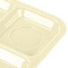 A tan Carlisle polypropylene tray with six compartments.