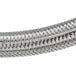 A close up of a braided metal tube for a Backyard Pro LP Regulator.