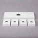 A white rectangular box with a silver logo and 4 white rectangular dishes inside.