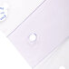 A close-up of a clear plastic Curtron door strip with a hole in it.