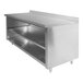 A stainless steel Advance Tabco work table with a fixed midshelf.
