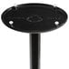 A black Lancaster Table & Seating cast iron bar height table base with white screws on it.