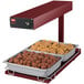 A Hatco Glo-Ray heated food warmer with trays of meatballs and chicken.